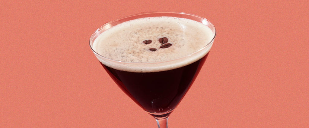 Tanglewood Espresso Martini garnished with coffee beans with a pink background