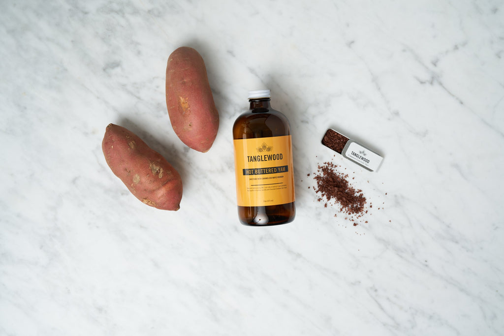 Hot Buttered Yam with Yams, Chocolate Cinnamon Salt and a bottle. 